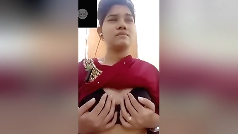 Tiny brunette woman showing off her small boobs and pussy