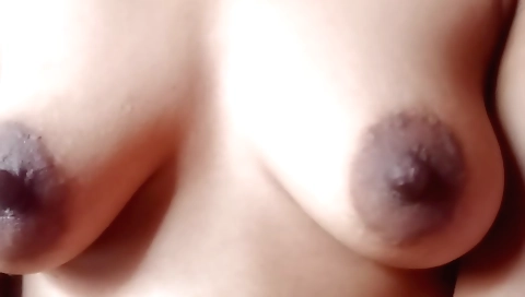 Desi hottie in a dress and black top plays with fingers