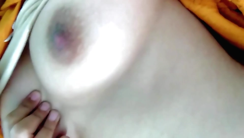 Indian girl shows off her large boobs in the bedroom