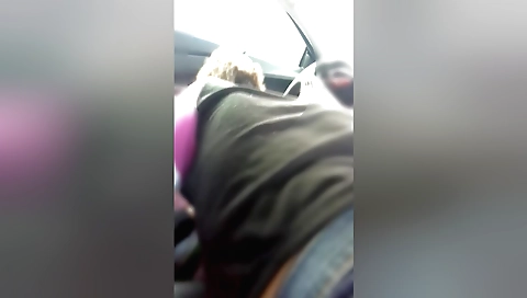 Brunette with a beautiful face sucks my man in a parking lot