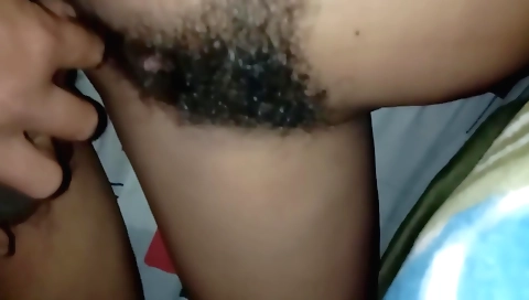 Hairy babe touches her cunt and gives a nice massage