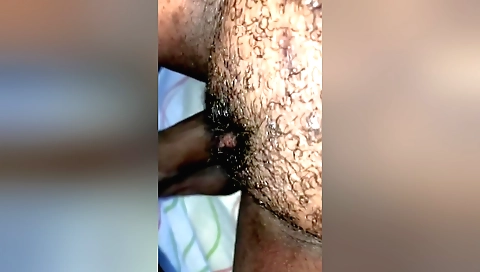 A hairy girl takes a big bite of his dick in class