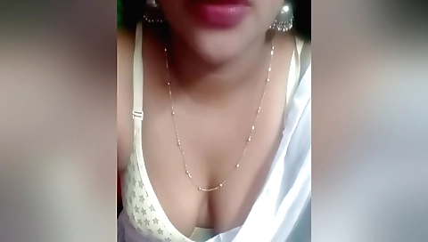 Indian brunette with a sexy lingerie is having fun with her hands