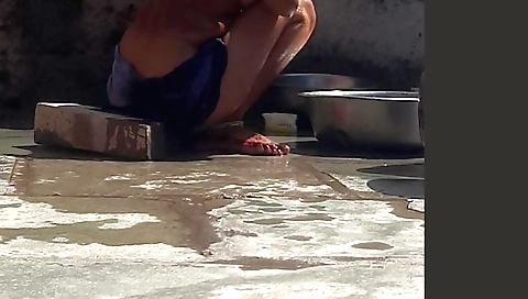 Indian stepsister-in-law is taking a bath near the road