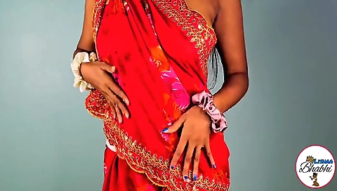 Indian chick dances with the camera in the kitchen