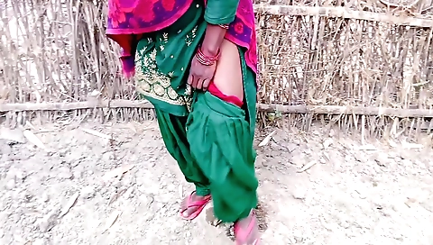 Solo female with hair touches outdoor village with village bhabhi