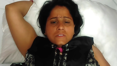 Indian woman rides a guy in a red dress in the car