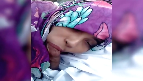 Indian girl in a black dress riding with her husband