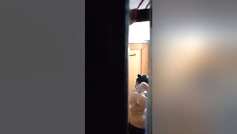 Indian girl in white lingerie and panties is taking off