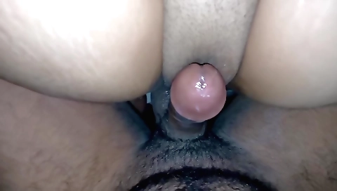 My little petite brunette rides in her bike on the street