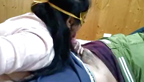 Sexy brunette in bikini and a sexy face of a pussy in a webcam