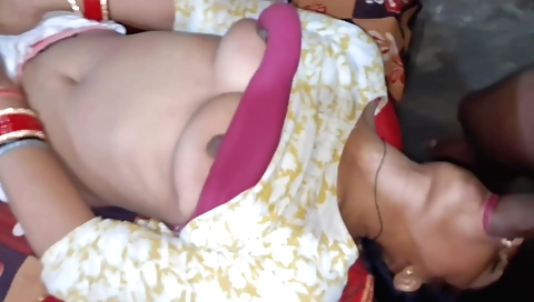 Brunette babe in a red blouse is enjoying a blowjob