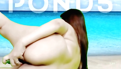 Brunette indian enjoys herself on the beach in bed